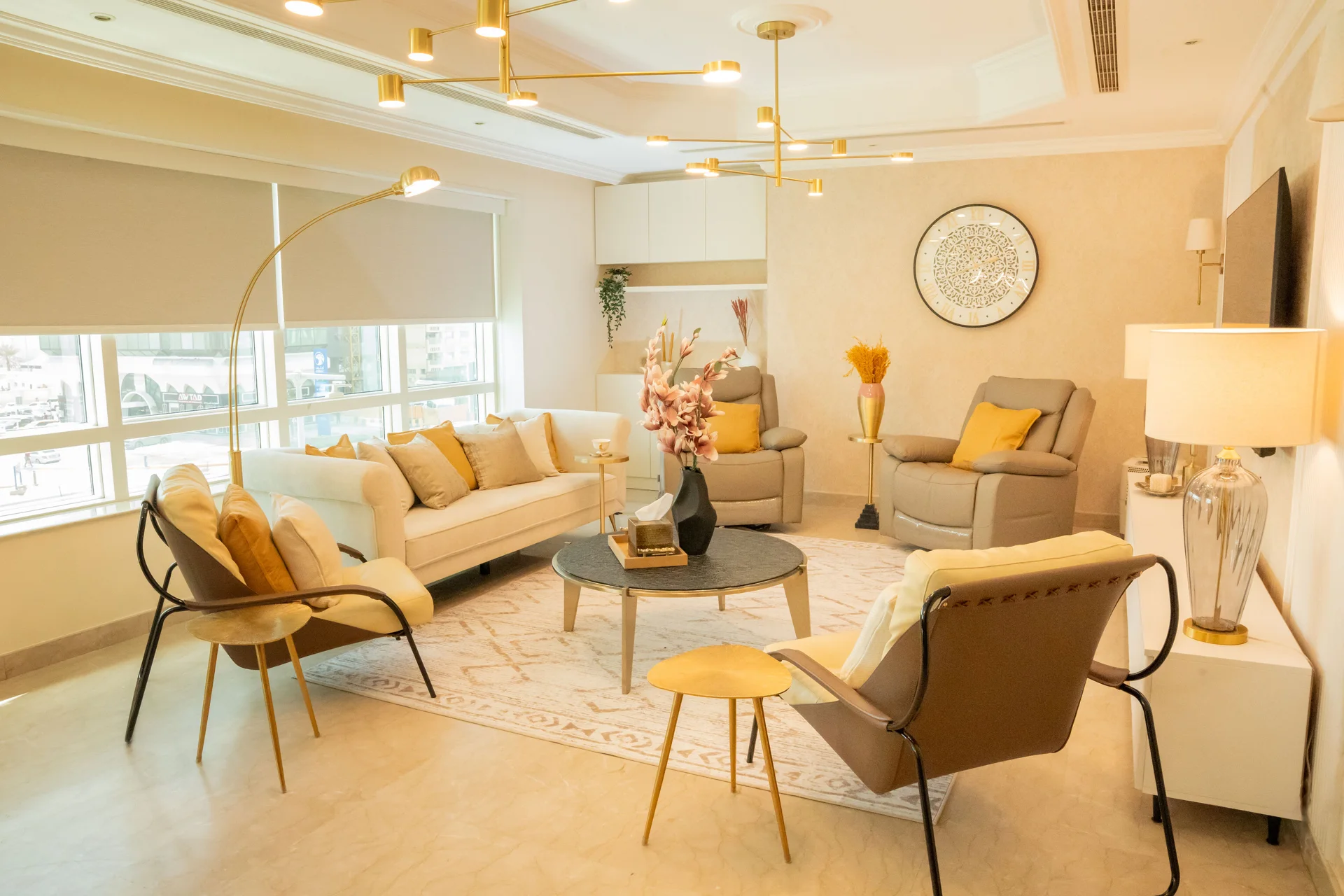 Abu Dhabi apartment with coordinated seating, a dining area and warm finishes