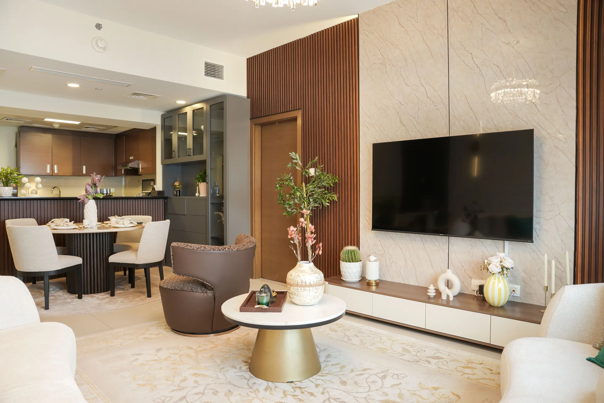 Dalla Carta apartment interior with bespoke wall panelling, a curved sofa and coordinated lighting